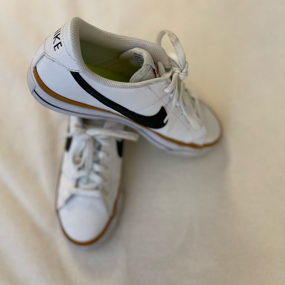 Nike White and Black Sneakers with Gold Trim